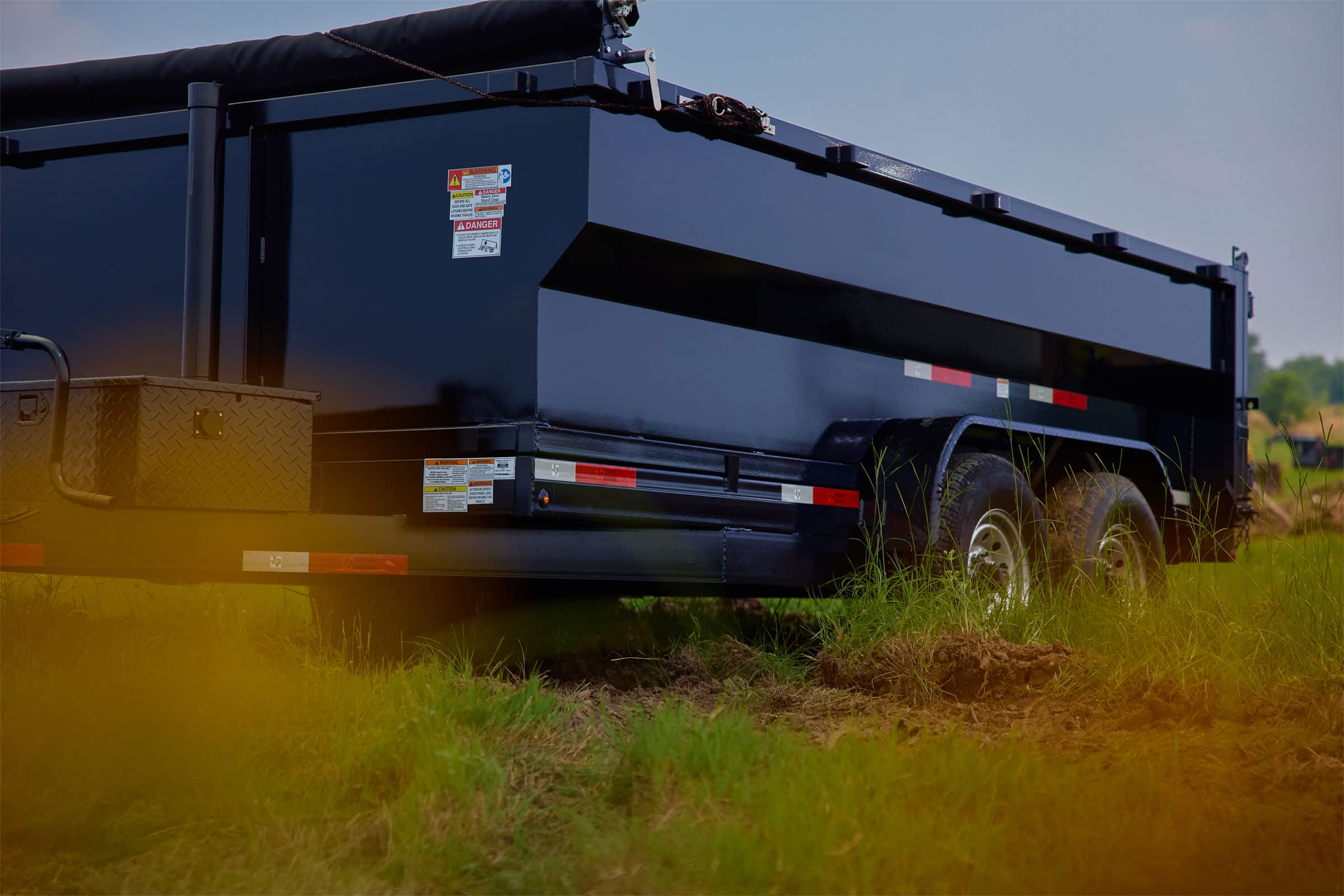 Dump trailer in a field.