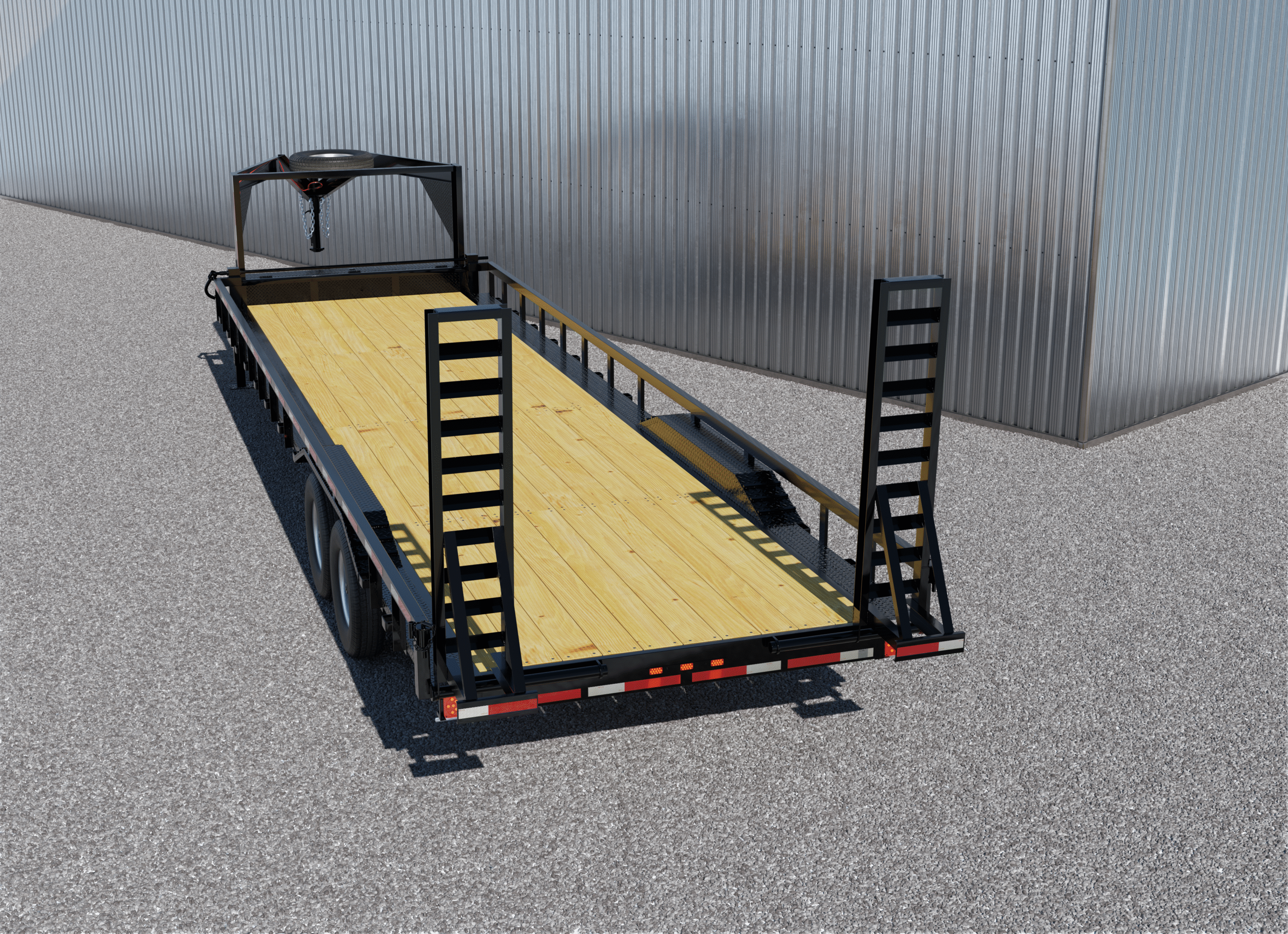 Texas Pride black gooseneck lowboy trailer with tandem axles, wood deck, and rear loading ramps, parked on gravel in front of a metal building. Designed for hauling heavy equipment and machinery.