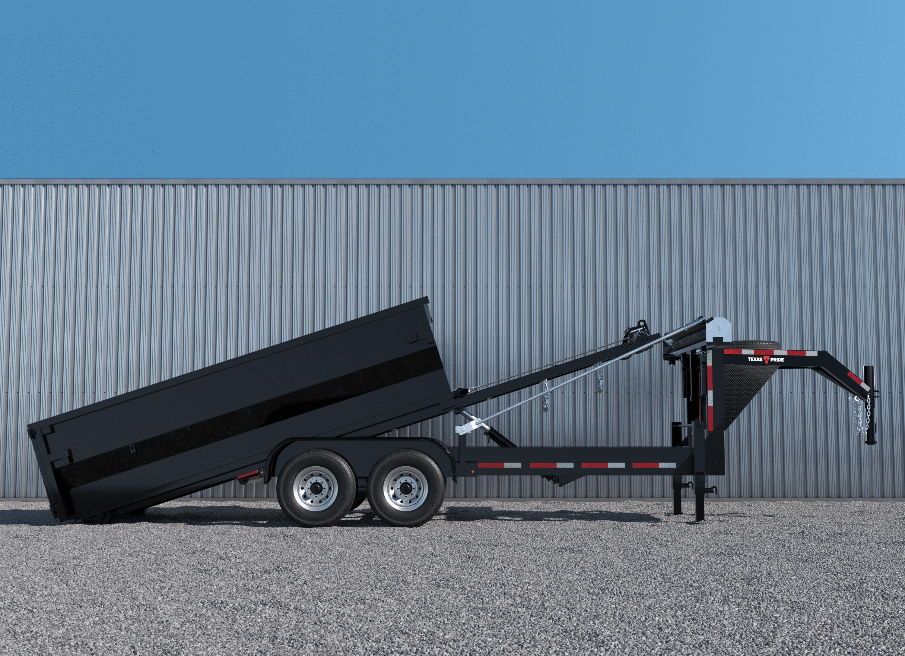 Texas Pride black gooseneck roll-off trailer with a raised dumpster shown mid-unload, positioned on gravel in front of a metal-sided building. Represents the importance of regular trailer maintenance for safe, reliable operation.